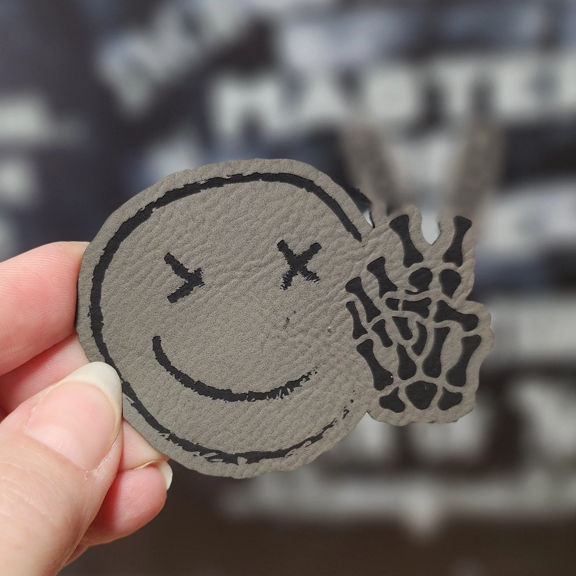 Chilling Smiley with Bones (Grey) Engraved Leatherette Hat Patch - MR01