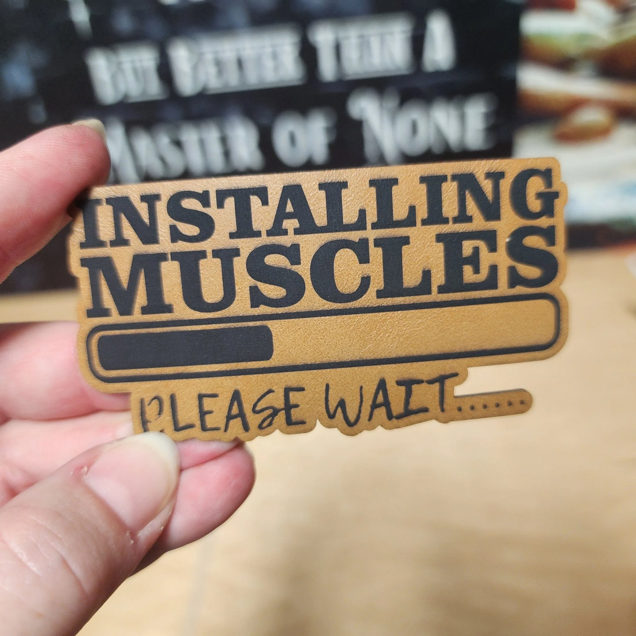 Muscle Installation In Progress (Saddle Tan) Engraved Leatherette Hat Patch - MR01