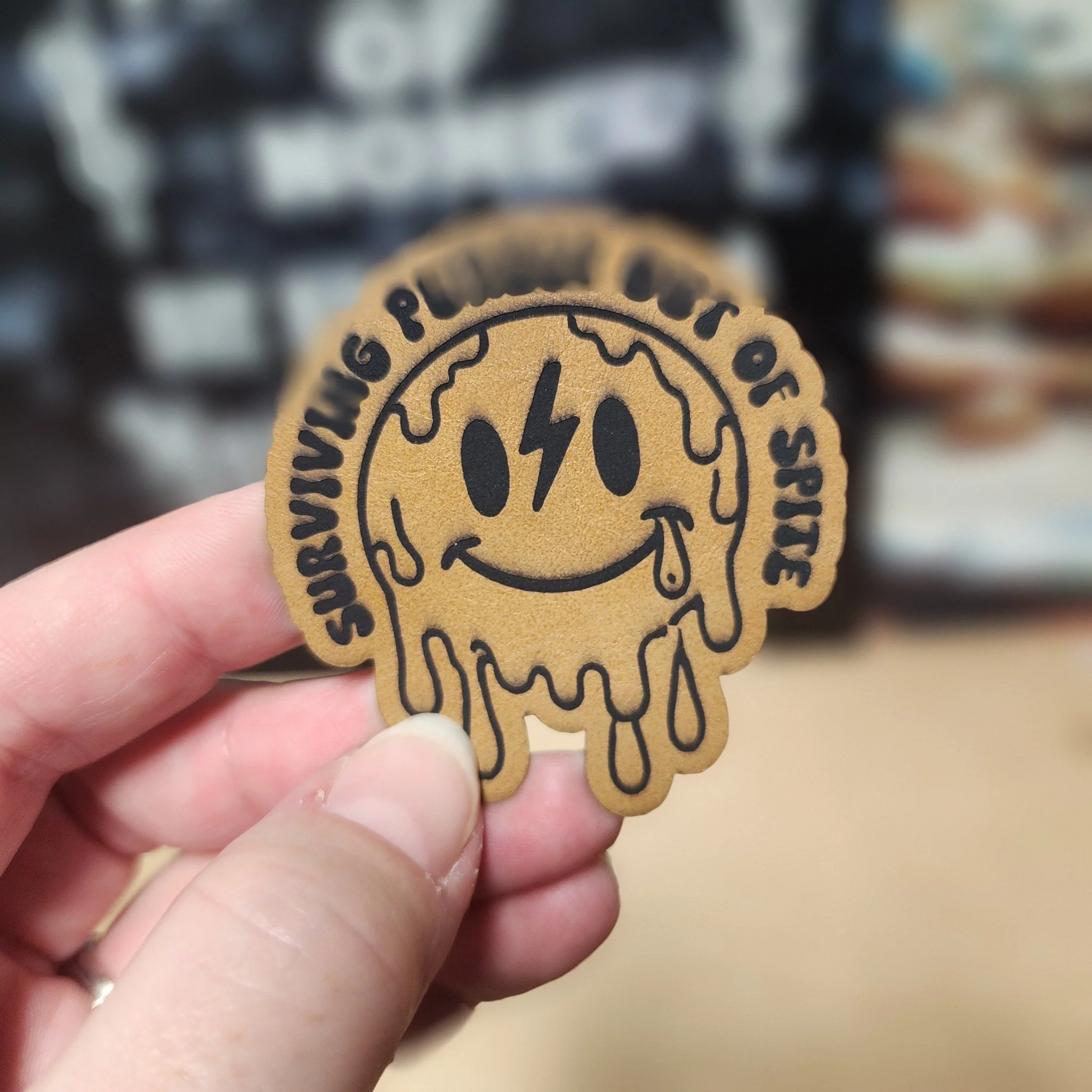 Surviving Out of Spite (Saddle Tan) Engraved Leatherette Hat Patch - MR01